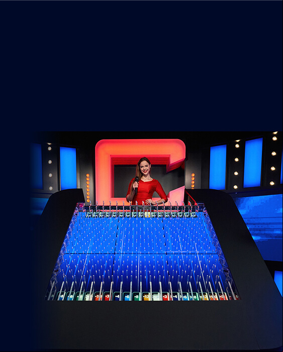 A lady in a red dress holding a microphone