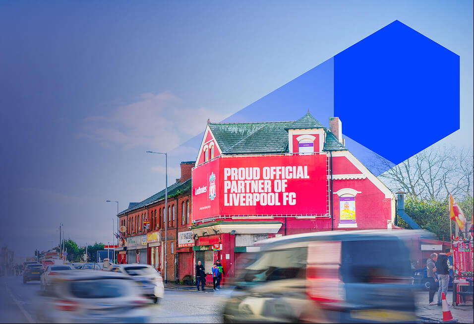 A large billboard advertising Ladbrokes partnering with Liverpool FC