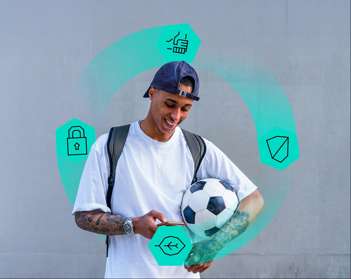 A young man looking at his phone with the sustainability icons circling around him